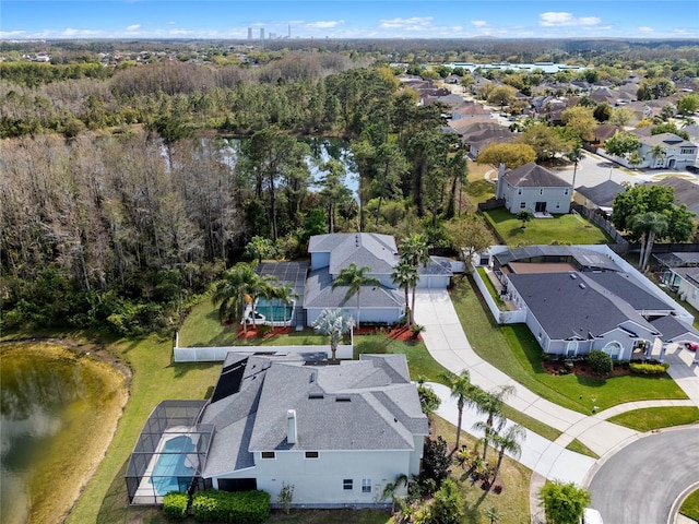 aerial view with a residential view and a wooded view