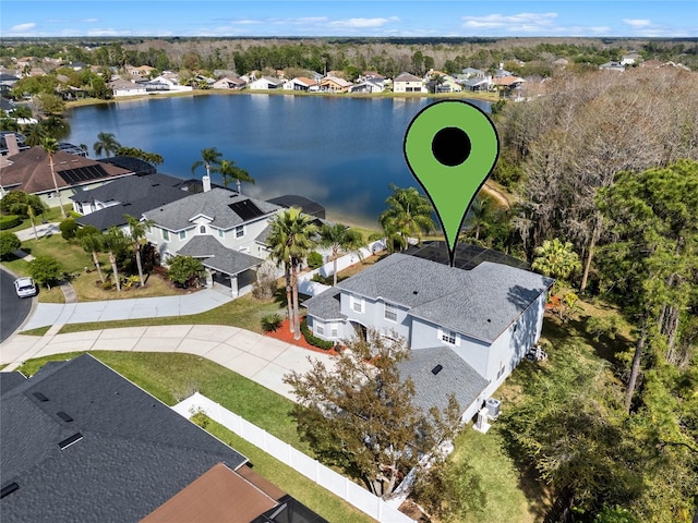 birds eye view of property featuring a residential view and a water view