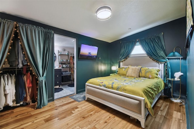 bedroom with wood finished floors