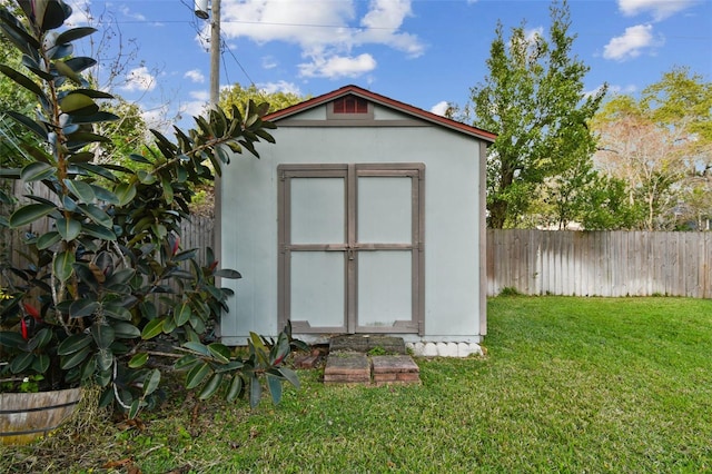 view of shed featuring a fenced backyard