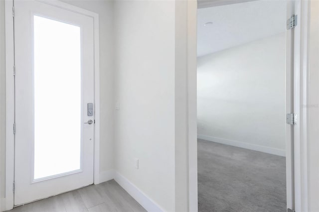 17442 Hidden Forest Dr, Clermont, FL 34714 - doorway to outside with baseboards