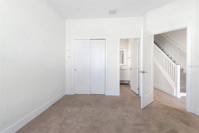 17442 Hidden Forest Dr, Clermont, FL 34714 - unfurnished bedroom with carpet, a closet, and baseboards