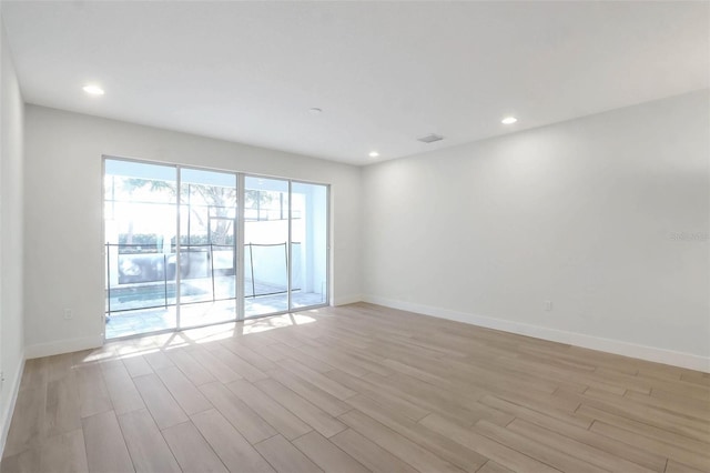 17442 Hidden Forest Dr, Clermont, FL 34714 - empty room with light wood-style floors, baseboards, and recessed lighting
