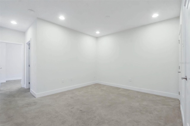 17442 Hidden Forest Dr, Clermont, FL 34714 - unfurnished room with light carpet, recessed lighting, baseboards, and a smoke detector