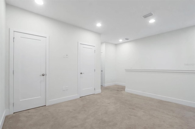 17442 Hidden Forest Dr, Clermont, FL 34714 - spare room featuring light carpet, recessed lighting, and baseboards