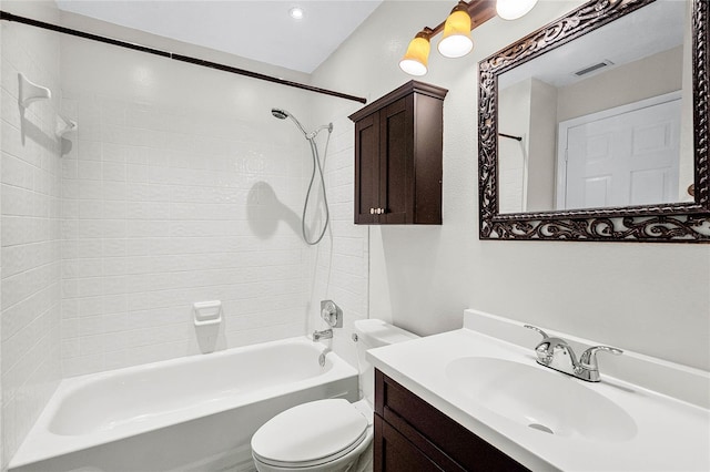 bathroom with toilet, visible vents,  shower combination, and vanity