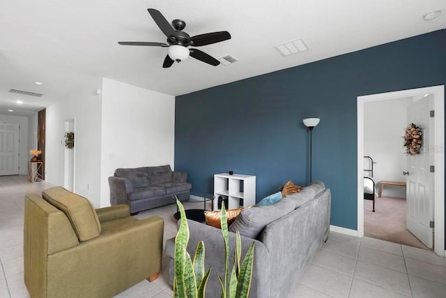 living area featuring light tile patterned floors, ceiling fan, visible vents, and recessed lighting