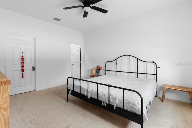 bedroom with baseboards, carpet flooring, visible vents, and a ceiling fan