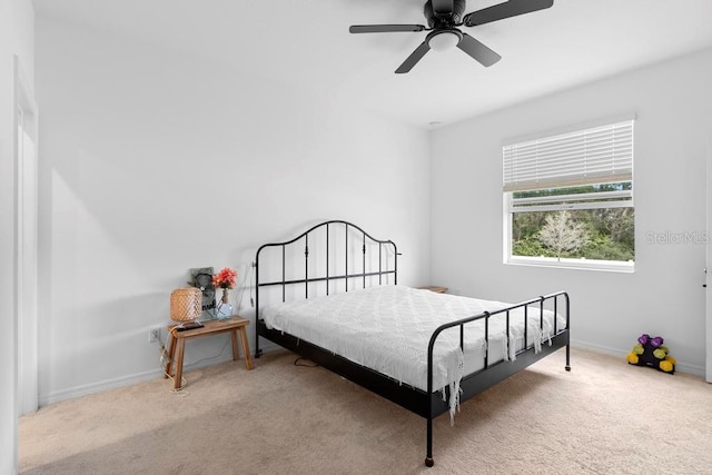 bedroom with carpet flooring, ceiling fan, and baseboards