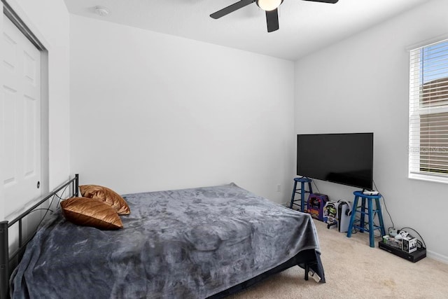 bedroom with carpet and a ceiling fan