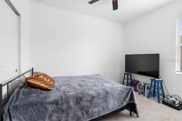 bedroom with ceiling fan and carpet floors