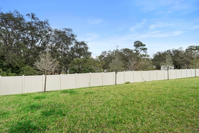 view of yard with fence