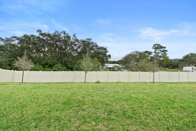 view of yard featuring fence