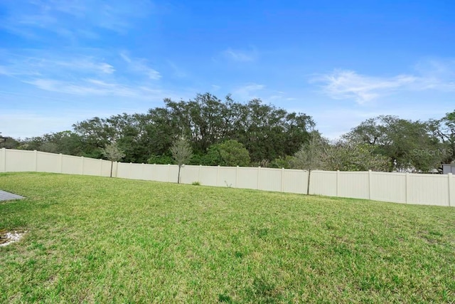 view of yard featuring fence