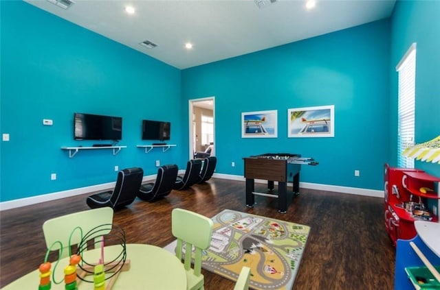 game room featuring dark wood-type flooring, recessed lighting, visible vents, and baseboards