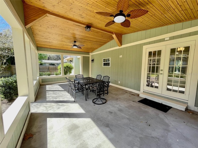 view of patio / terrace featuring outdoor dining area, a ceiling fan, and french doors