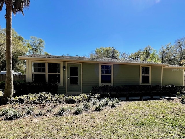 view of front of home featuring fence