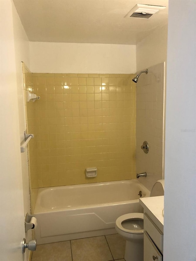 full bathroom featuring toilet, visible vents, vanity, shower / bathing tub combination, and tile patterned floors