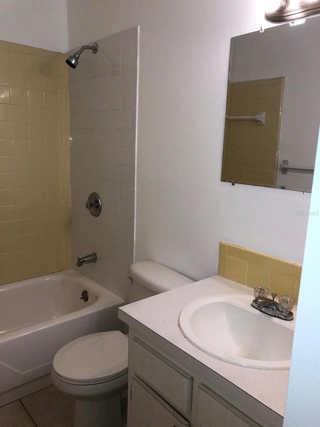 full bath with toilet, shower / washtub combination, vanity, and tile patterned floors