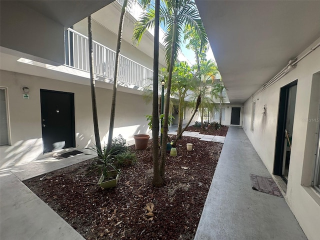 view of yard with a balcony