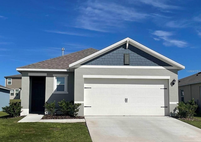 single story home featuring a shingled roof, driveway, a garage, and stucco siding