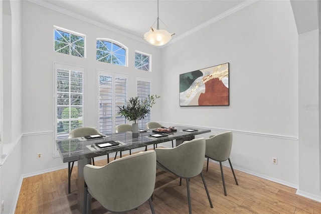 1203 Gatwick Loop, Lake Mary, FL 32746 - dining room featuring healthy amount of natural light, ornamental molding, wood finished floors, and baseboards