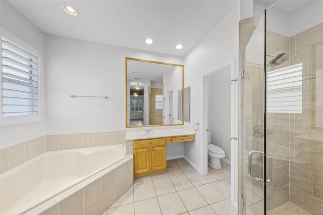 1203 Gatwick Loop, Lake Mary, FL 32746 - bathroom with a shower stall, a garden tub, tile patterned floors, toilet, and vanity