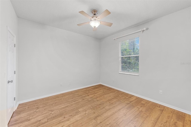 1203 Gatwick Loop, Lake Mary, FL 32746 - empty room with a ceiling fan, light wood-style floors, and baseboards