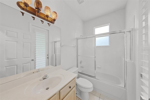 1203 Gatwick Loop, Lake Mary, FL 32746 - full bath featuring toilet, vanity, enclosed tub / shower combo, and tile patterned floors