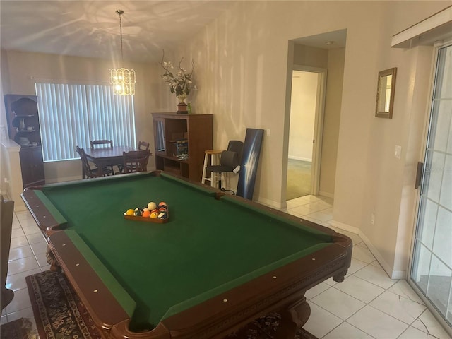 recreation room with a chandelier, pool table, light tile patterned floors, and baseboards