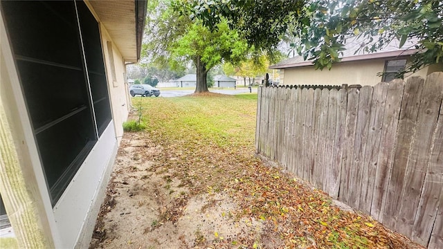 view of yard featuring fence