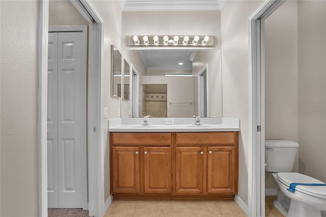 bathroom featuring ornamental molding, a closet, a sink, and toilet