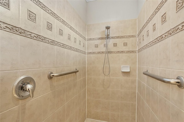 bathroom with tiled shower