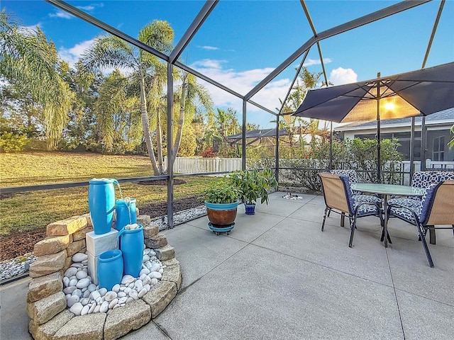 view of patio / terrace featuring glass enclosure