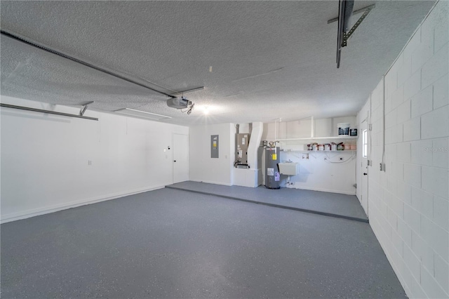 garage featuring concrete block wall, electric panel, electric water heater, and a garage door opener