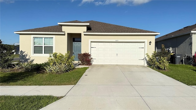 view of front of home featuring a garage, a shingled roof, concrete driveway, stucco siding, and a front lawn