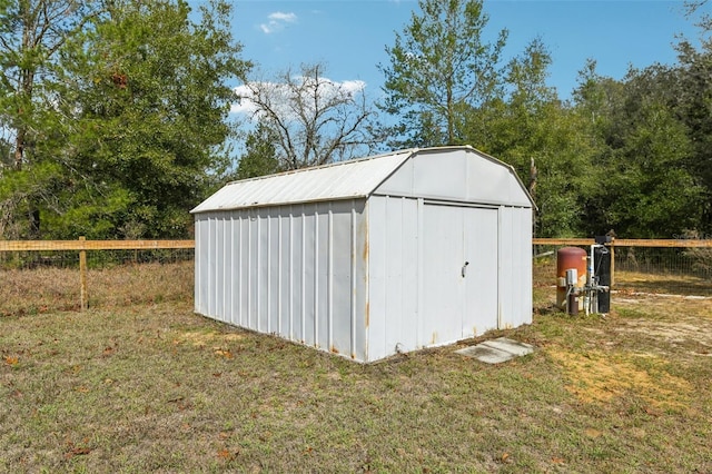 view of shed with fence