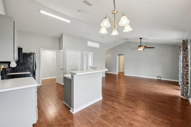 25 Maple Crse, Ocklawaha, FL 32179 - kitchen featuring electric range oven, lofted ceiling, ceiling fan, light countertops, and a chandelier
