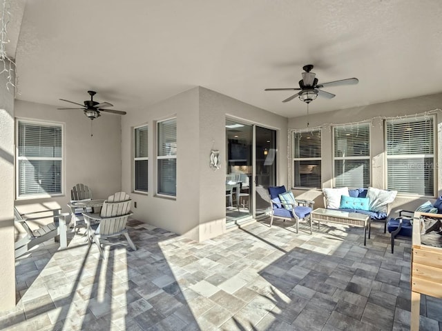 view of patio featuring outdoor lounge area and ceiling fan