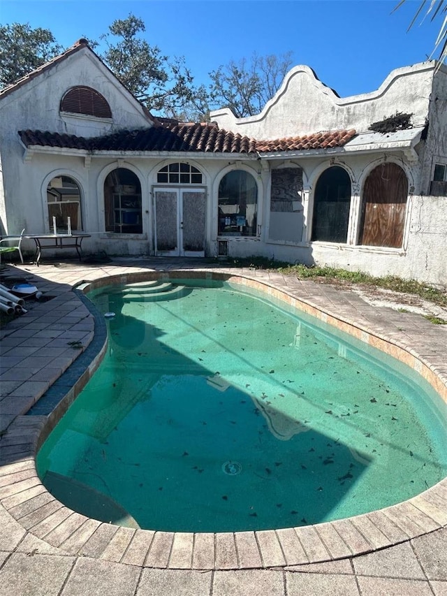 outdoor pool with a patio