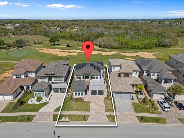 birds eye view of property featuring a residential view and golf course view