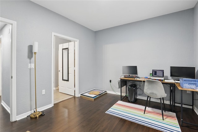 office area featuring baseboards and wood finished floors