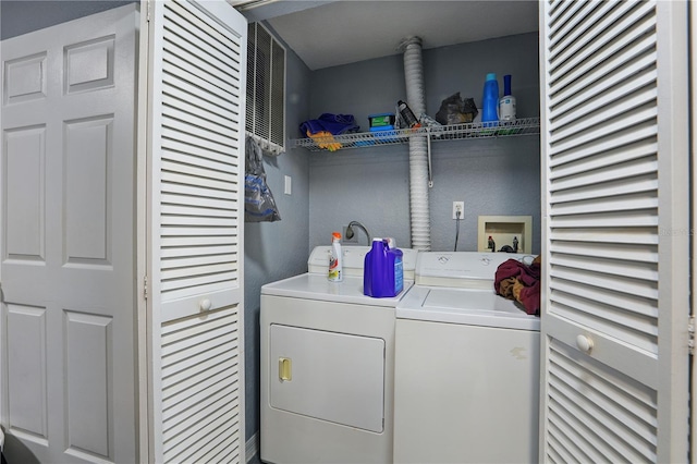 washroom with laundry area and washer and dryer