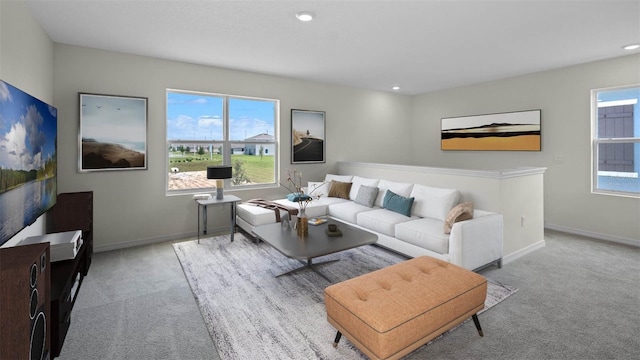 living area with recessed lighting, light colored carpet, and baseboards