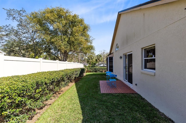 view of yard with a patio and fence