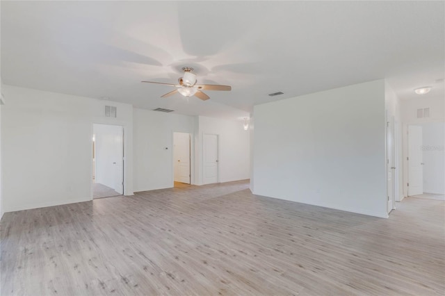 unfurnished room with light wood finished floors, ceiling fan, and visible vents