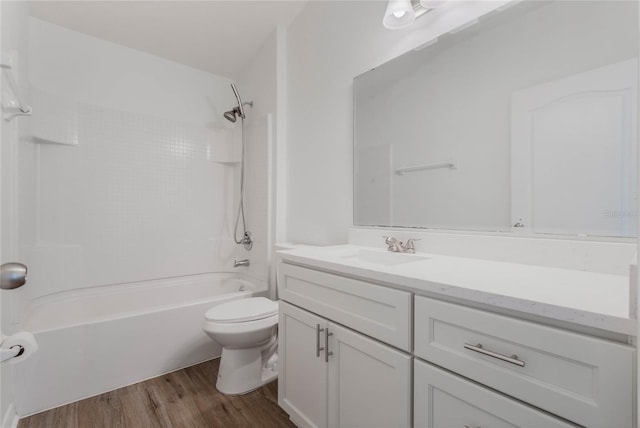 full bath with toilet, vanity, shower / tub combination, and wood finished floors