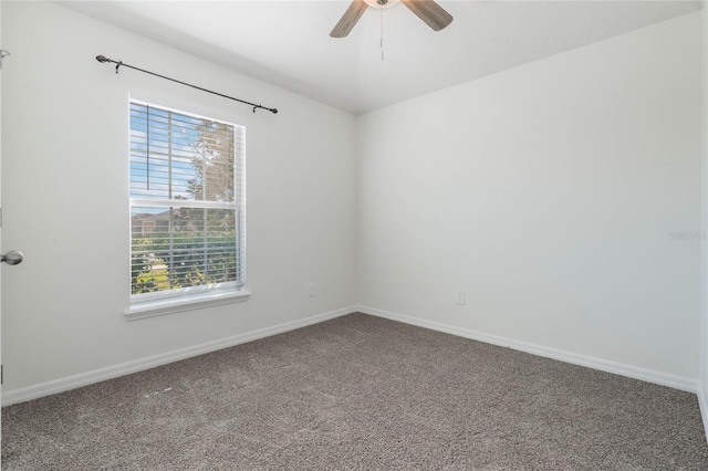 spare room featuring ceiling fan, baseboards, and carpet flooring