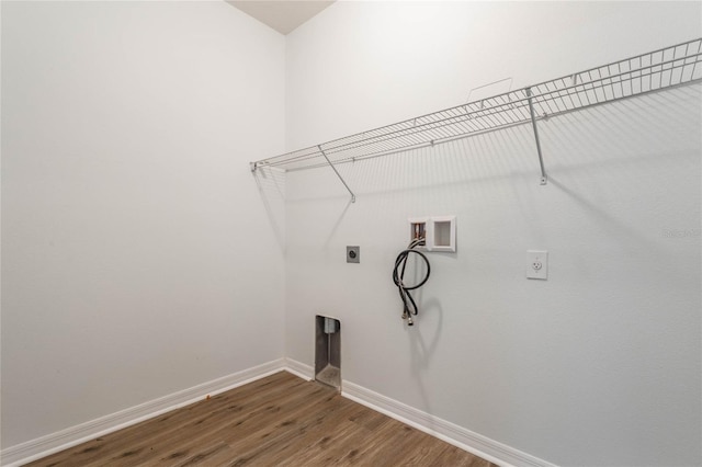 laundry room featuring washer hookup, hookup for an electric dryer, wood finished floors, laundry area, and baseboards