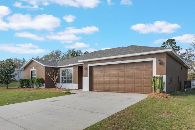 ranch-style house featuring a front yard, central AC, an attached garage, and stucco siding